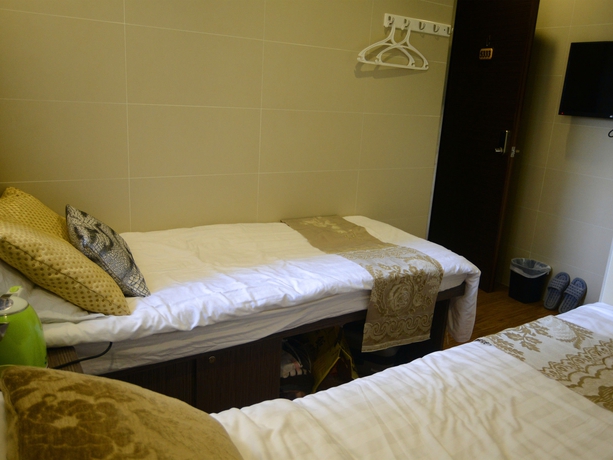 Imagen de la habitación del Hotel Kong Hing Guest House. Foto 6
