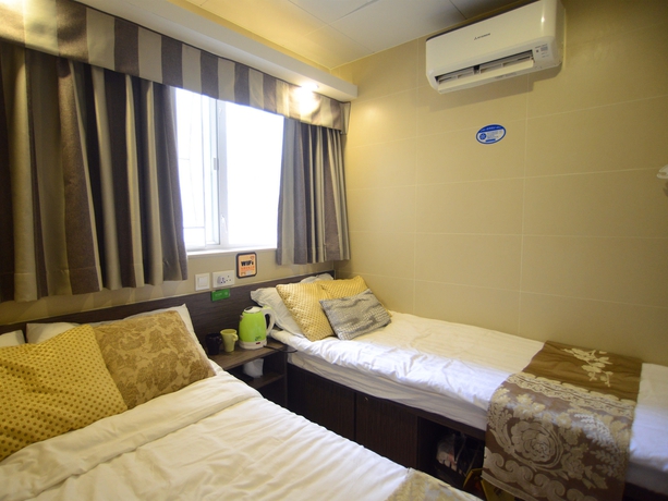 Imagen de la habitación del Hotel Kong Hing Guest House. Foto 7