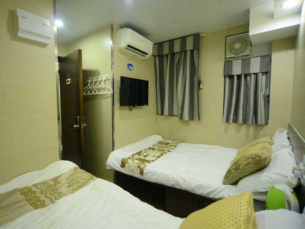 Imagen de la habitación del Hotel Kong Hing Guest House. Foto 8