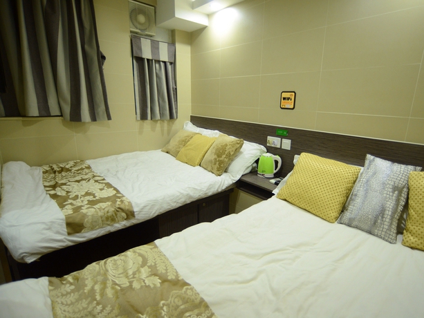 Imagen de la habitación del Hotel Kong Hing Guest House. Foto 9