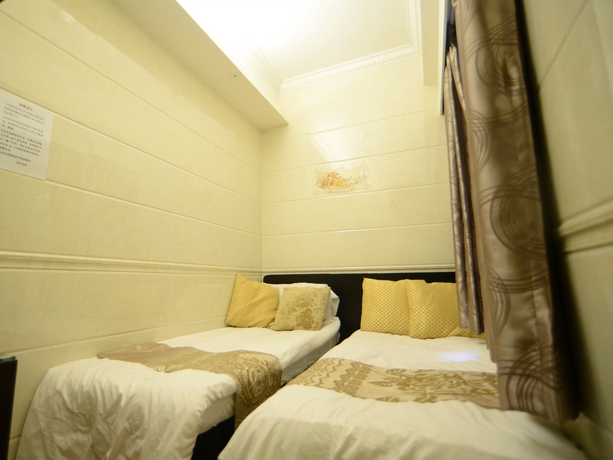 Imagen de la habitación del Hotel Kong Hing Guest House. Foto 10