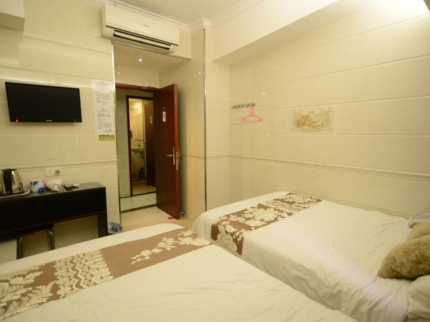 Imagen de la habitación del Hotel Kong Hing Guest House. Foto 11