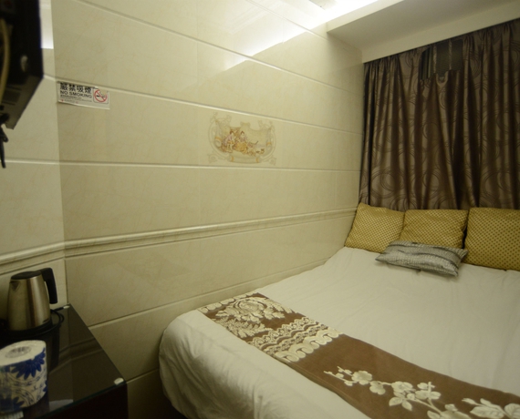 Imagen de la habitación del Hotel Kong Hing Guest House. Foto 12