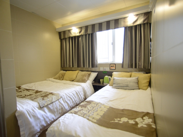 Imagen de la habitación del Hotel Kong Hing Guest House. Foto 13