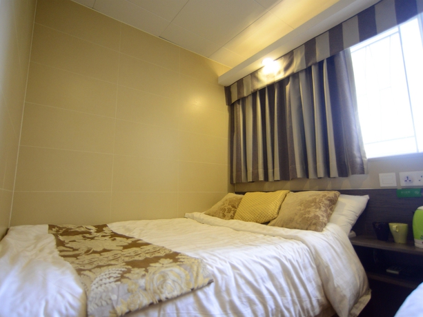 Imagen de la habitación del Hotel Kong Hing Guest House. Foto 15