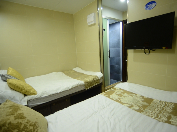 Imagen de la habitación del Hotel Kong Hing Guest House. Foto 16
