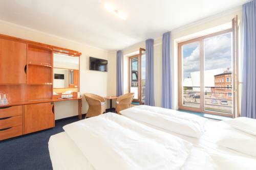 Imagen de la habitación del Hotel Kontorhaus Stralsund. Foto 13