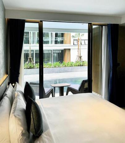 Imagen de la habitación del Hotel Kora Beach Resort Phuket. Foto 15