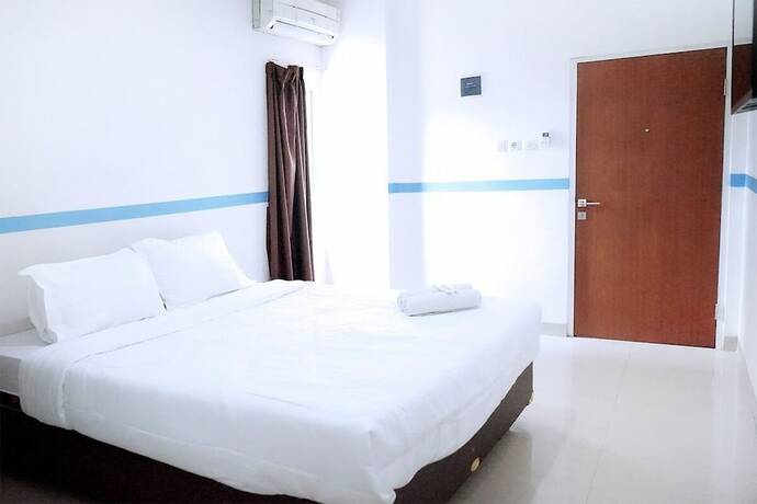 Imagen de la habitación del Hotel Kost Syailendra by Ruang Nyaman. Foto 12