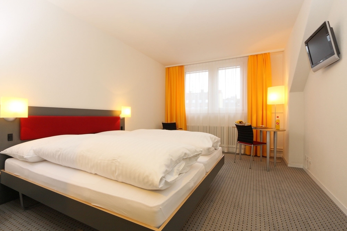 Imagen de la habitación del Hotel Kreuz Bern Modern City. Foto 9