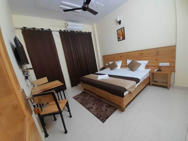 Imagen de la habitación del Hotel Krishna Rishikesh. Foto 8