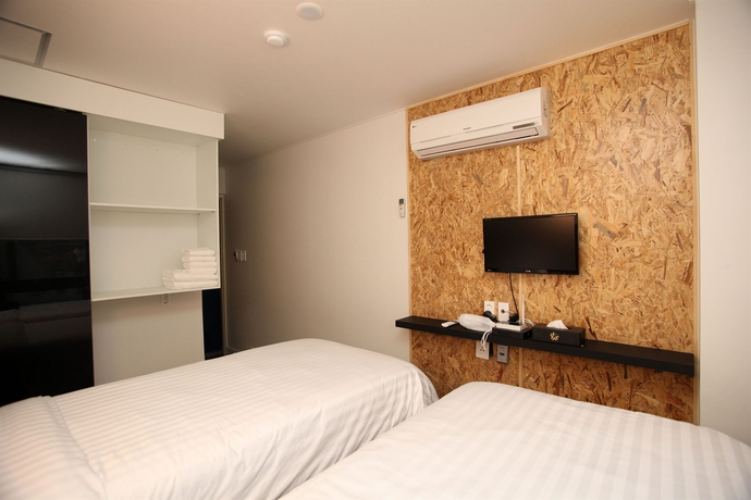 Imagen de la habitación del Hotel Kstar Metro. Foto 11