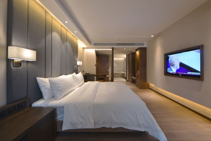 Imagen de la habitación del Hotel Kuanrong Luxury Suites - Daping Times Square. Foto 12