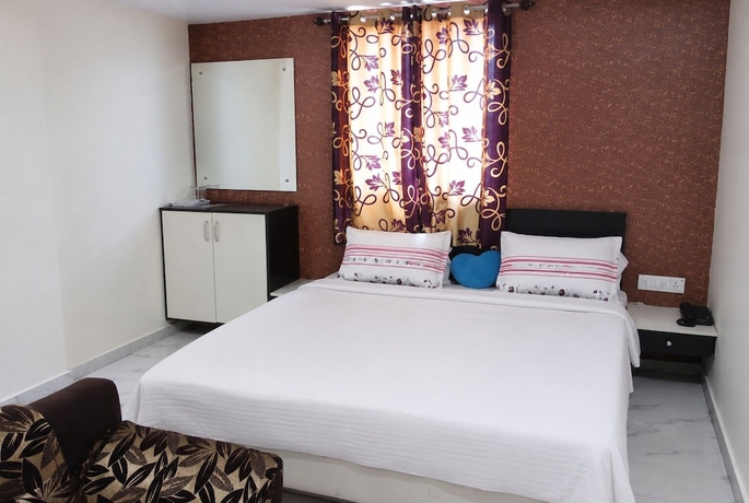 Imagen de la habitación del Hotel Kuber, Rajkot. Foto 13