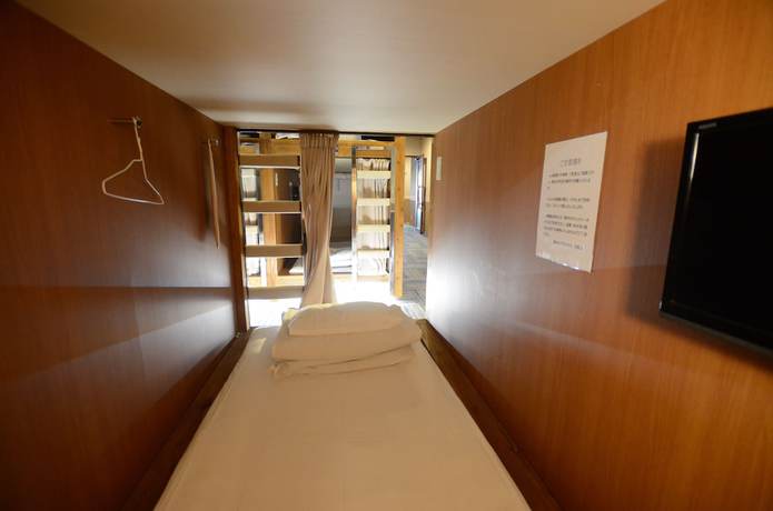 Imagen de la habitación del Hotel Kumamoto Capsule - Hostel, Caters To Men. Foto 14