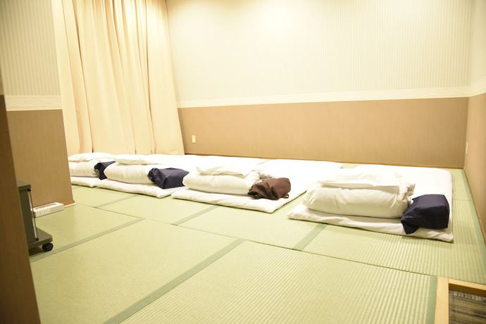 Imagen de la habitación del Hotel Kumamoto Capsule - Hostel, Caters To Men. Foto 17
