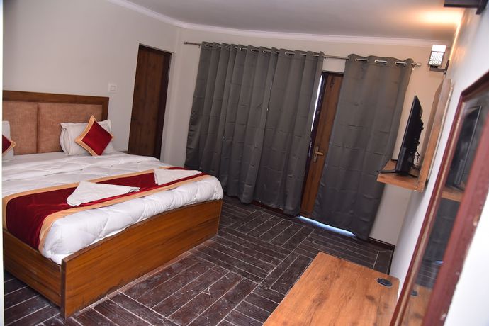 Imagen de la habitación del Hotel Kumaon Roop Resort. Foto 9
