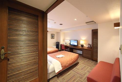 Imagen de la habitación del Hotel Kumegawa Wing. Foto 17
