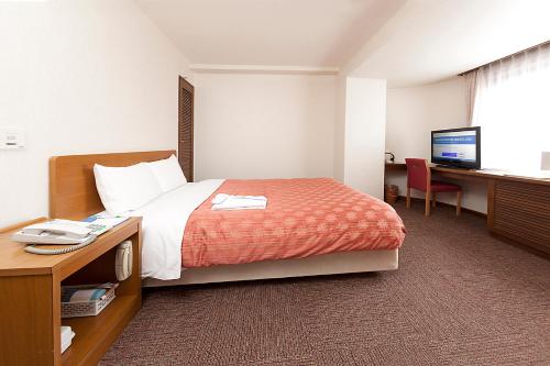 Imagen de la habitación del Hotel Kumegawa Wing. Foto 19