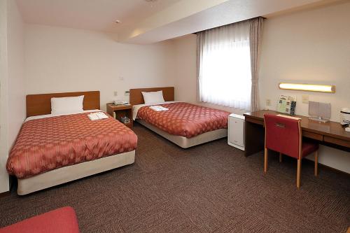 Imagen de la habitación del Hotel Kumegawa Wing. Foto 20