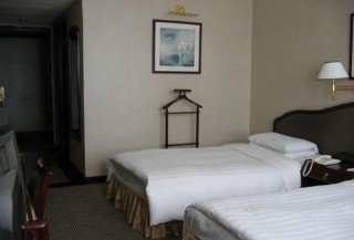 Imagen de la habitación del Hotel KunMing. Foto 11