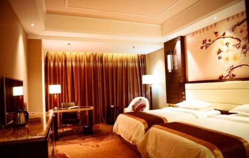 Imagen de la habitación del Hotel Kunlun Zhongxin Street. Foto 9