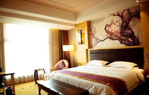 Imagen de la habitación del Hotel Kunlun Zhongxin Street. Foto 12