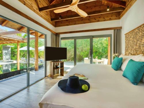 Imagen de la habitación del Hotel Kuredhivaru Resort and Spa Maldives. Foto 17