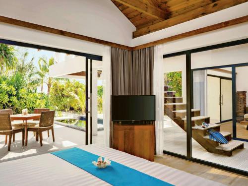 Imagen de la habitación del Hotel Kuredhivaru Resort and Spa Maldives. Foto 18