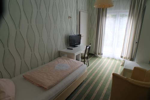 Imagen de la habitación del Hotel Kurhotel Quellenhof. Foto 11