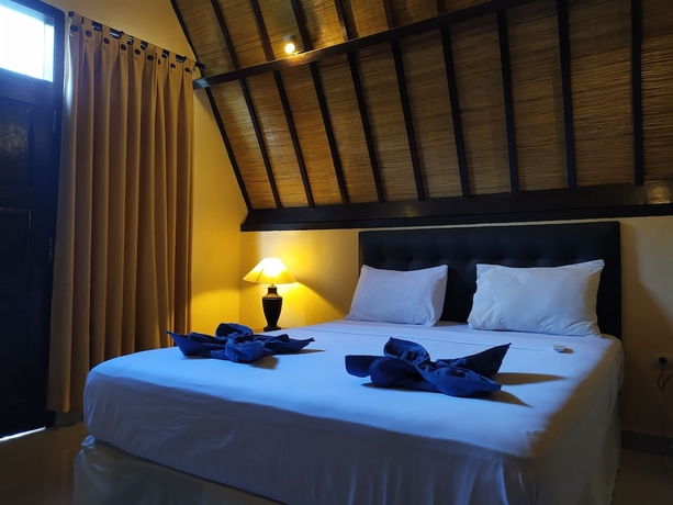 Imagen de la habitación del Hotel Kusuka Bungalows. Foto 7