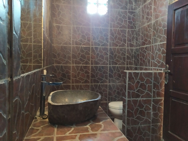 Imagen de la habitación del Hotel Kusuka Bungalows. Foto 9