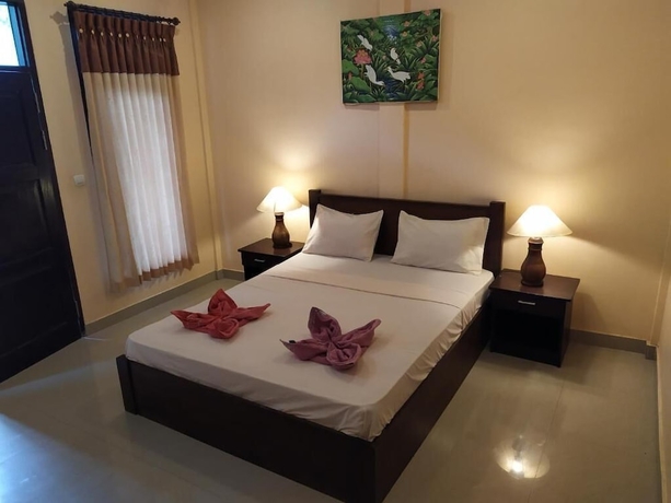 Imagen de la habitación del Hotel Kusuka Bungalows. Foto 13