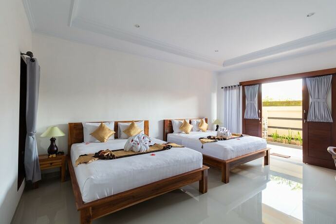 Imagen de la habitación del Hotel Kusuma Guesthouse. Foto 19