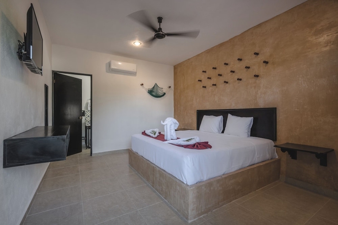 Imagen de la habitación del Hotel Kuxtal. Foto 7