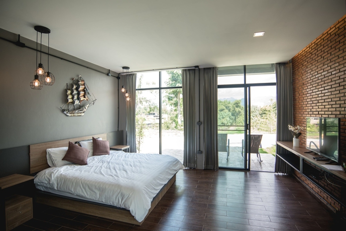 Imagen de la habitación del Hotel Kwai Tara Riverside Villas. Foto 11
