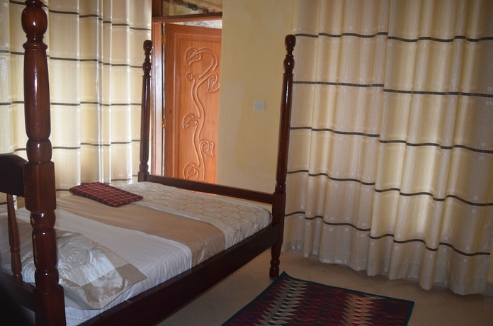 Imagen de la habitación del Hotel Kyaninga Royal Cottage. Foto 7