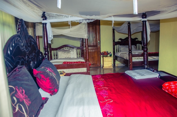 Imagen de la habitación del Hotel Kyaninga Royal Cottage. Foto 8