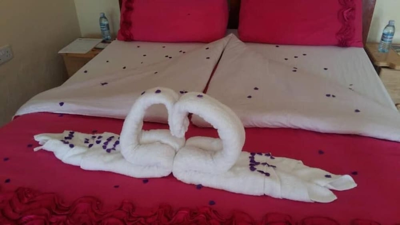 Imagen de la habitación del Hotel Kyaninga Royal Cottage. Foto 12