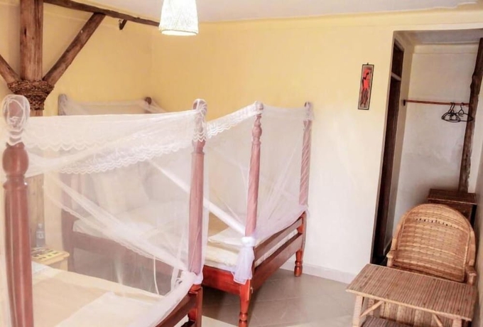 Imagen de la habitación del Hotel Kyaninga Royal Cottage. Foto 14