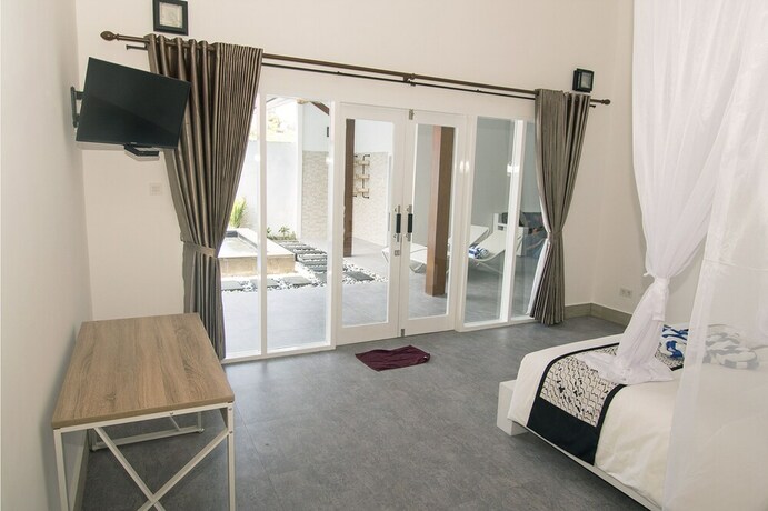 Imagen de la habitación del Hotel Kygunaya Villa. Foto 21