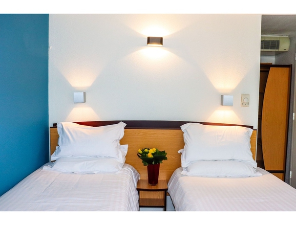 Imagen de la habitación del Hotel Kyriad Direct Roanne. Foto 11