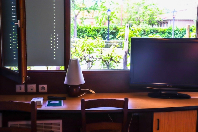 Imagen de la habitación del Hotel Kyriad Direct Roanne. Foto 12