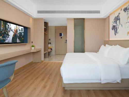 Imagen de la habitación del Hotel Kyriad Guigang Wuyue Plaza Railway Station. Foto 14