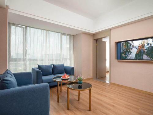 Imagen de la habitación del Hotel Kyriad Guigang Wuyue Plaza Railway Station. Foto 15