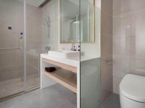 Imagen de la habitación del Hotel Kyriad Guigang Wuyue Plaza Railway Station. Foto 16