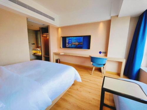Imagen de la habitación del Hotel Kyriad Guigang Wuyue Plaza Railway Station. Foto 17