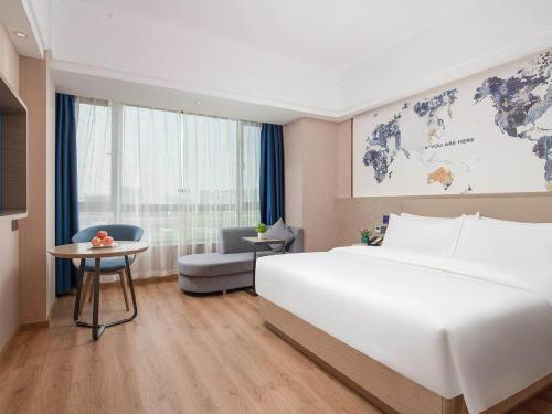 Imagen general del Hotel Kyriad Guigang Wuyue Plaza Railway Station. Foto 2