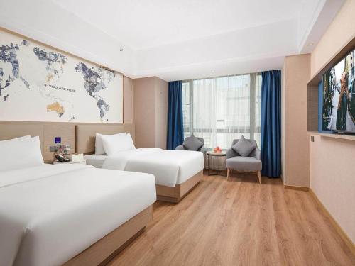 Imagen de la habitación del Hotel Kyriad Guigang Wuyue Plaza Railway Station. Foto 20