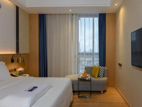 Imagen de la habitación del Hotel Kyriad Hanzhong Railway Station. Foto 14